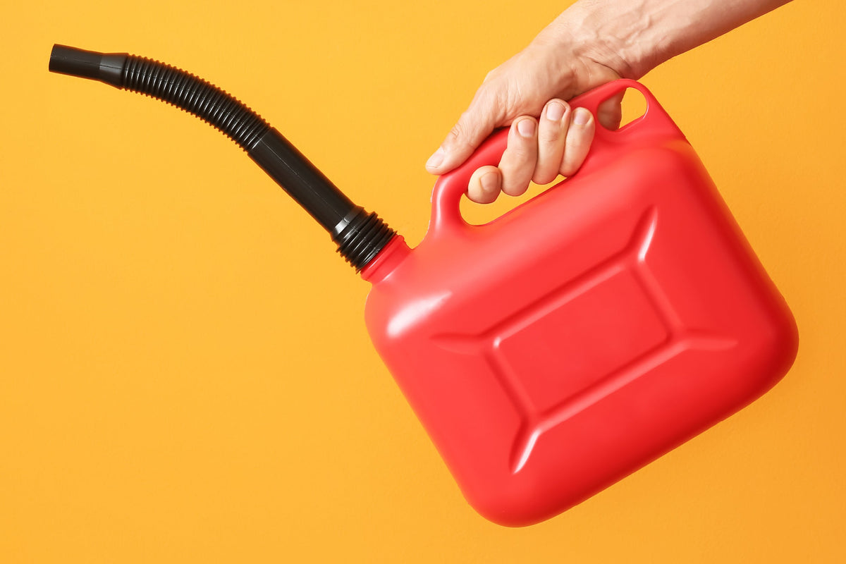 Hand Holding a Gas Can